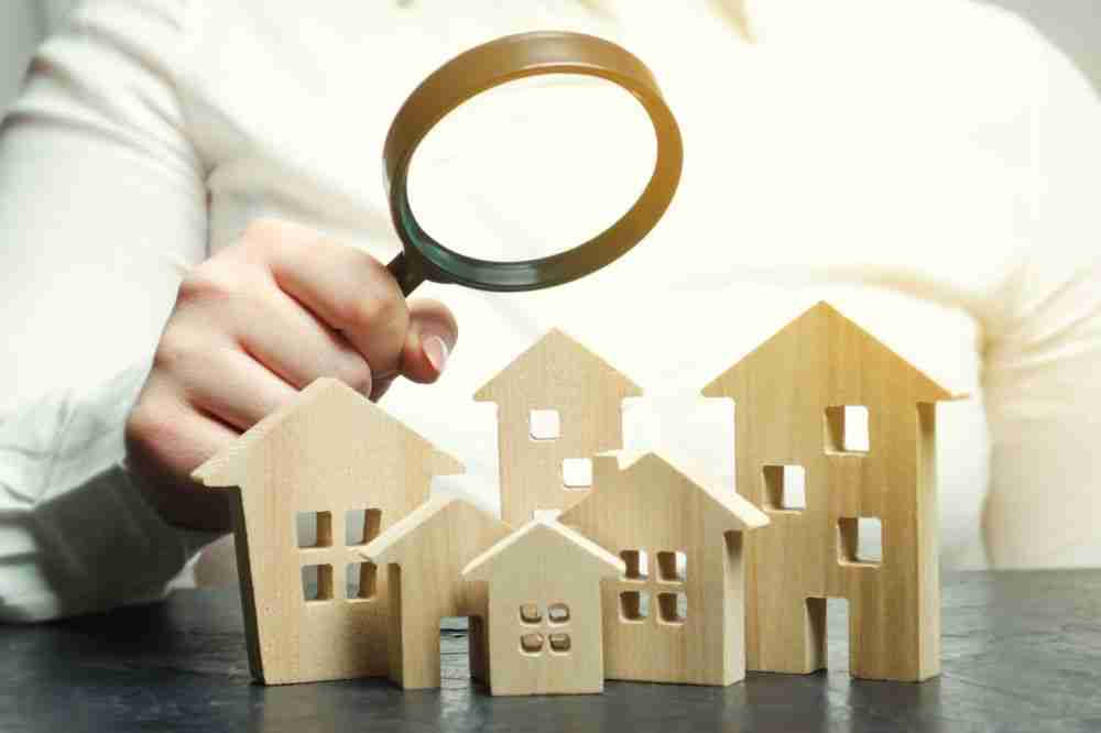 Bank Valuation examining wooden house models