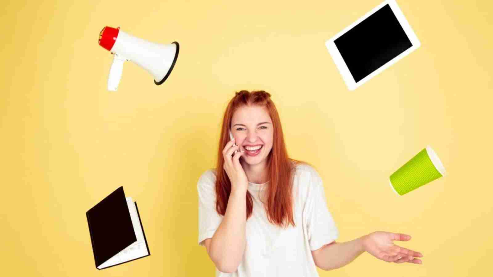 Interest Rates and House Prices, a cheerful woman talking on the phone with floating objects around her, symbolising multitasking and economy.